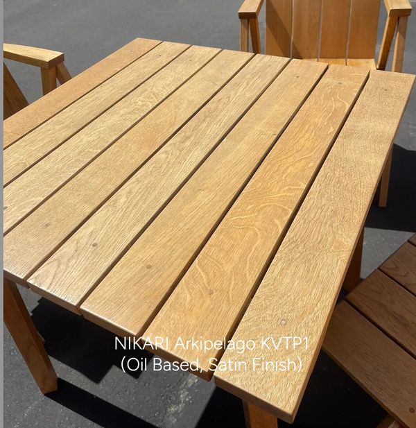 Wooden outdoor table with oil-based satin finish.