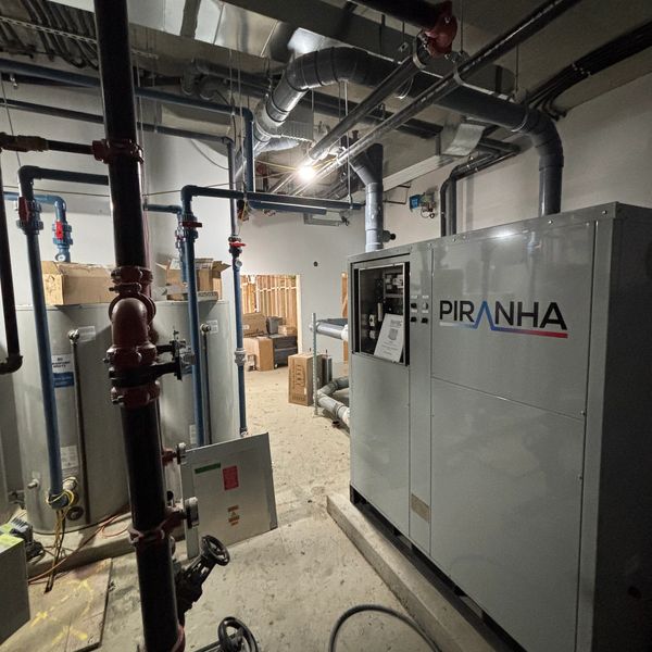 Industrial room with Piranha equipment and pipes.
