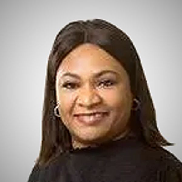 Portrait of a smiling woman with medium-length hair.