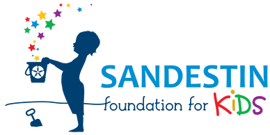 Logo of Sandestin Foundation for Kids with colorful stars and child silhouette.