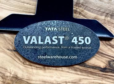 Tata Steel Valast 450 product label on a metal surface.