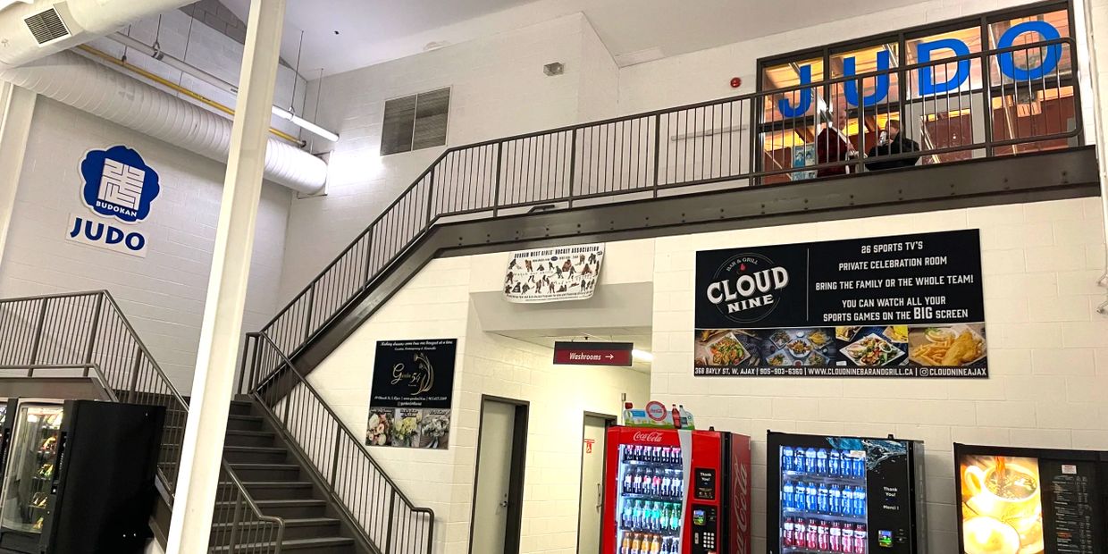 Judo signs next to some stairs