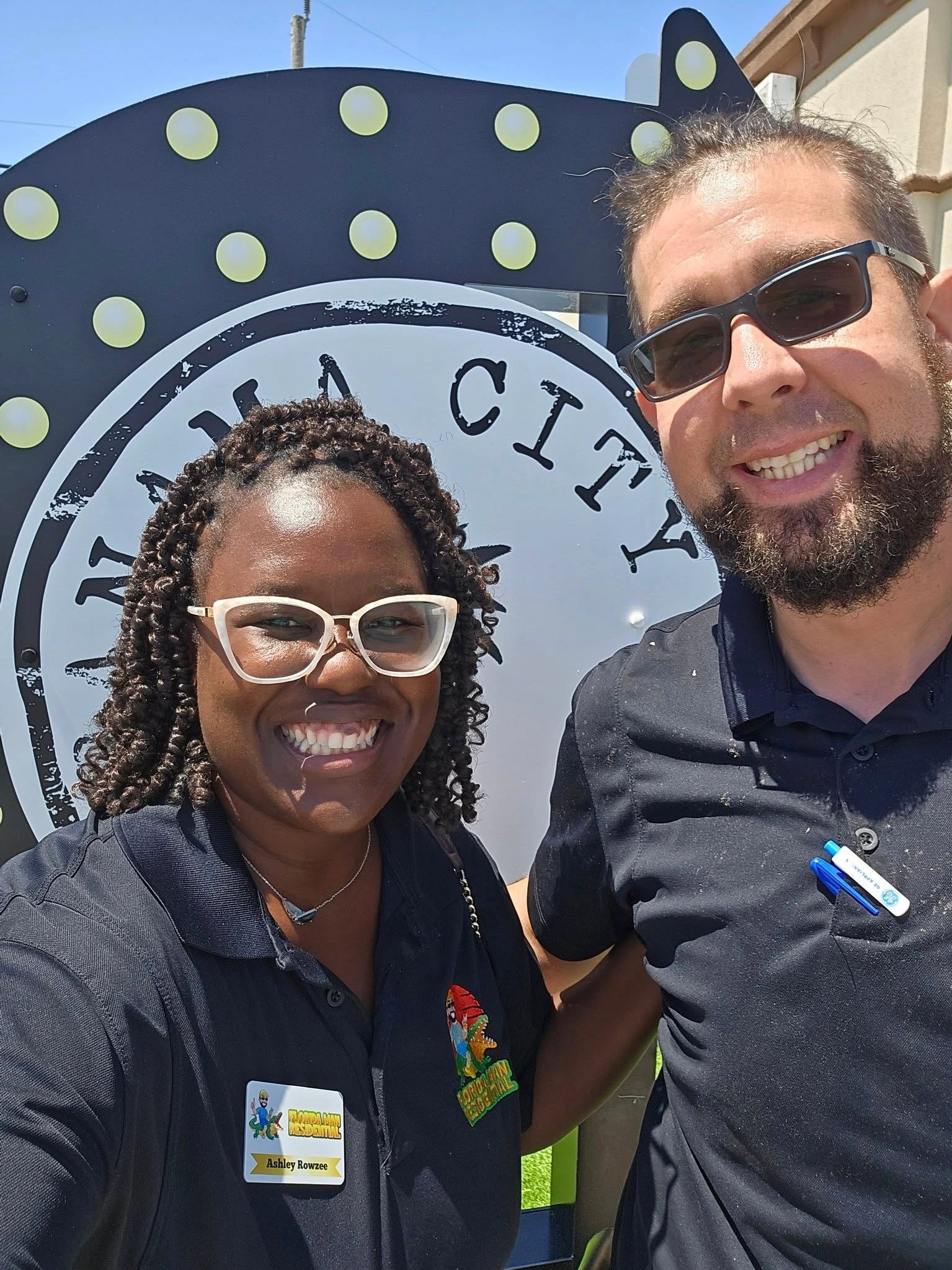 Owners Andrew & Ashley Rowzee wearing uniforms in Panama City for the Midea A/C Unity Update/Recall.