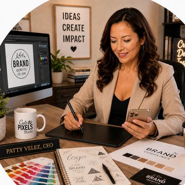 Woman working on brand design using a digital tablet and phone.