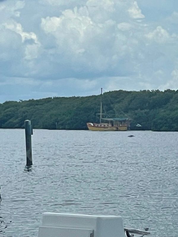 Captain Richard’s yellow boat across the water in Cortez, Florida.