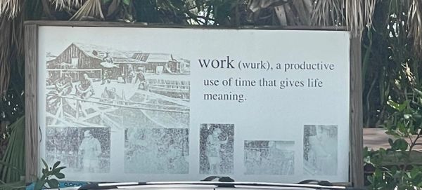 Sign at Star Fish Co. reading, “work (wurk), a productive use of time that gives life meaning.”