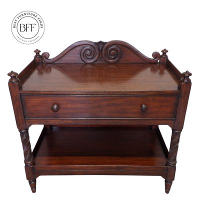 Antique wooden side table with a drawer and carved details.