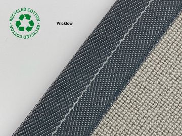 Close-up of a carpet corner labeled Wicklow made from recycled cotton.