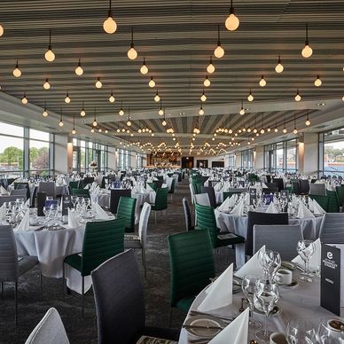 An image of headingley stadium emerald suite with bespoke raft ceiling and lighting design. 