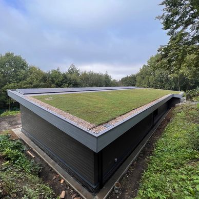 A image of a new build teaching facility with green roof