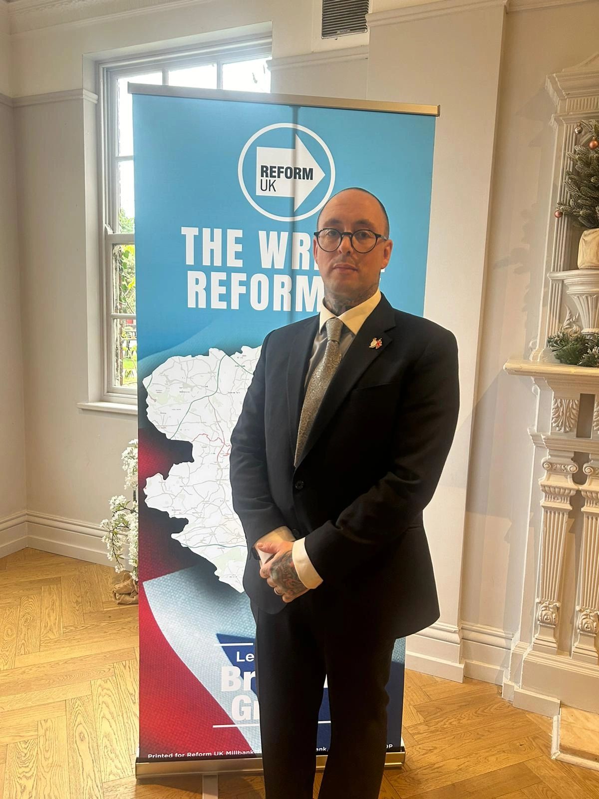 Andrew Radford CGC standing in front of The Wrekin Reform UK banner.