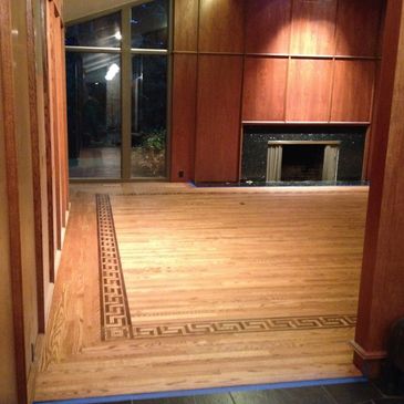 Image of a floor with an intricate border.