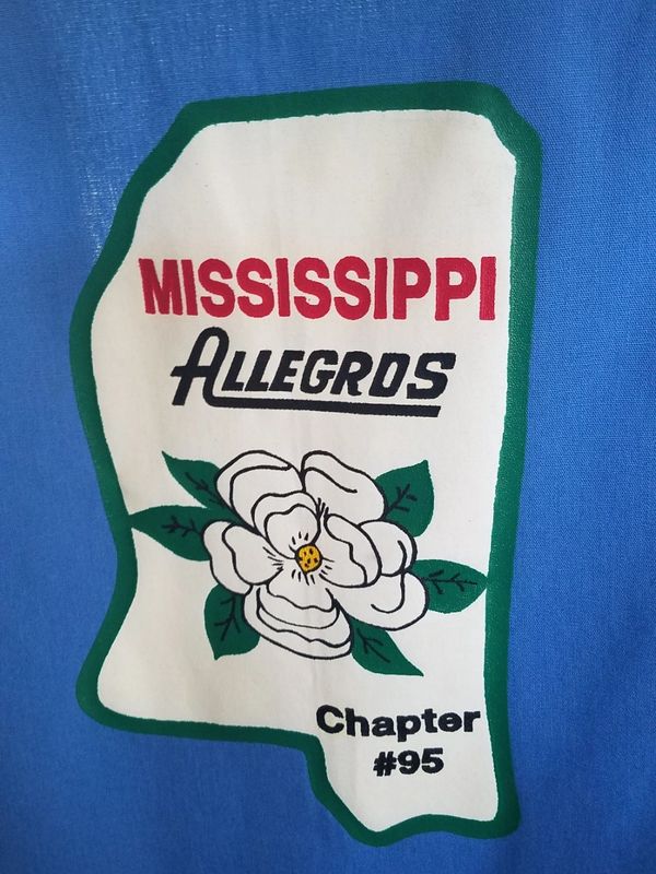 Mississippi Allegros Chapter #95 logo with a magnolia flower.