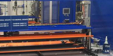 Automated De-gate machine. Cuts excess material from molder parts. De-gates entire length.