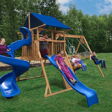 Small Single tower wood playset with slide and swings and rockwall