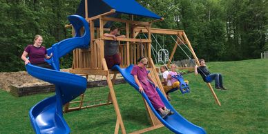 Small Single tower wood playset with slide and swings and rockwall