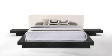 a bed with pillows on it 