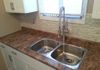 Small changes can make big improvements! Glass backsplash and new faucet.