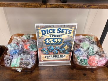 Sign advertising dice sets for $5.99 each with free dice bag.