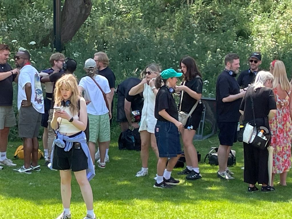 People gathered outdoors on a sunny day.