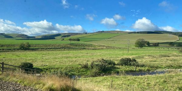 The rolling hill of the Scottish Borders taken from the Borders Rail Link.