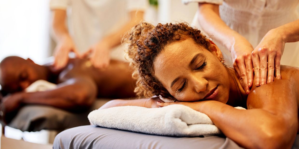 Two people enjoying relaxing massages at a spa.