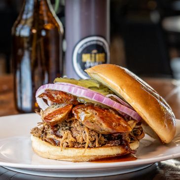 Pulled pork and sausage sandwich at a restaurant