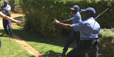 three security personnel taking part in emergency intervention training 