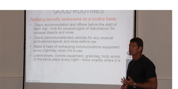 Presentation with screen showing training on civilian personal security awareness and preperation
