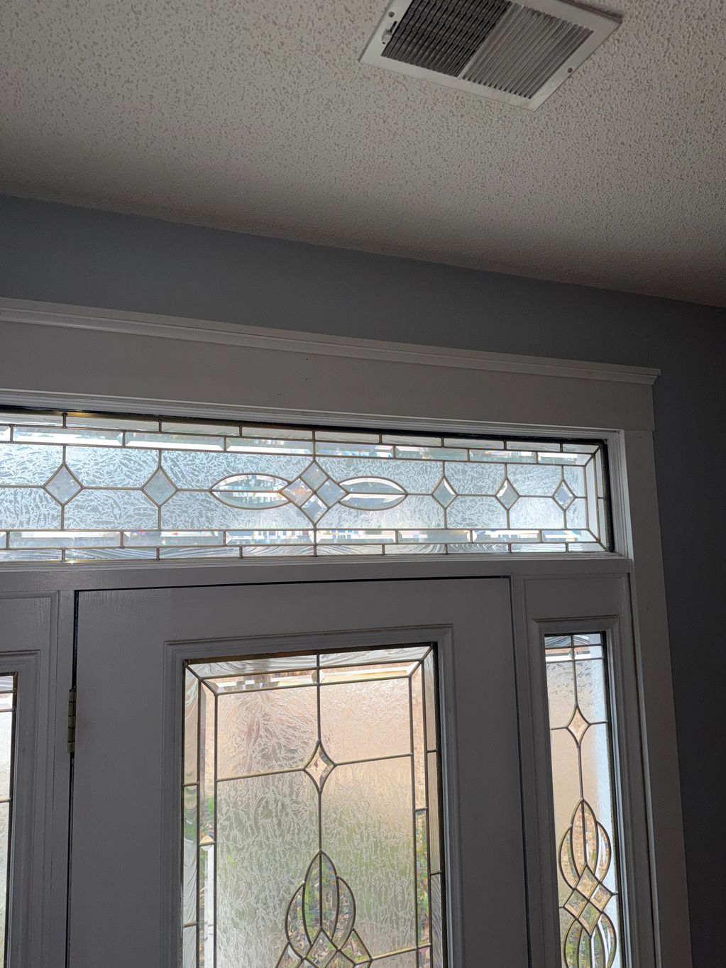 Changed outdated trim on our front door and rest of the house