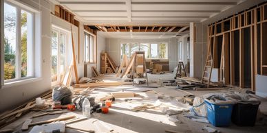 Interior under renovation with construction materials scattered around.
