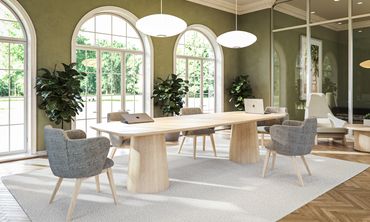 Elegant office space with arched windows and modern furniture.