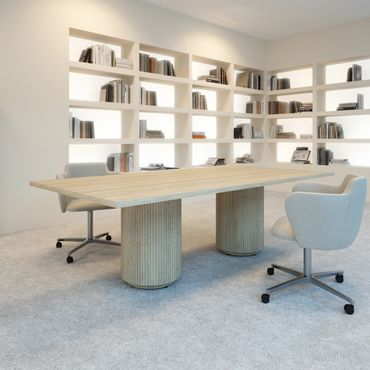Modern office with minimalistic design and bookshelves.