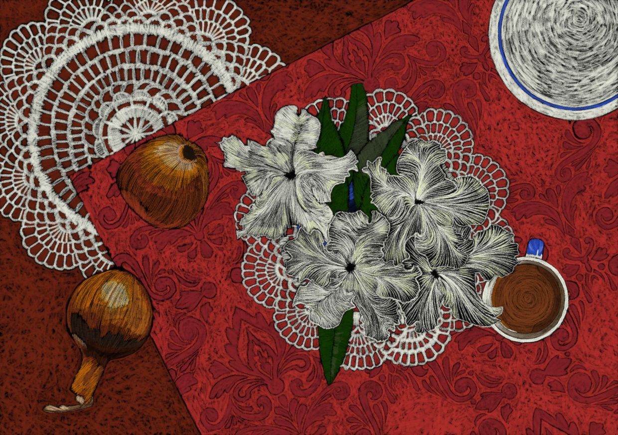 Artistic still life with flowers, nuts, and coffee on a red tablecloth.