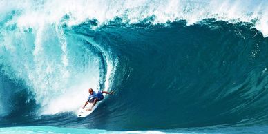 Surfer riding a big wave.