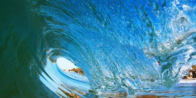 Inside view of a wave curling over.