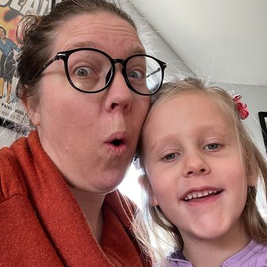 The daycare provider and her daughter making funny faces