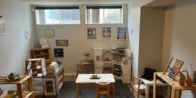Daycare space with Natural wood pieces, play kitchen and calming aesthetic