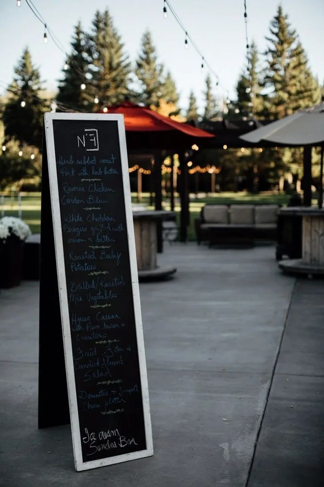Outdoor dinner buffet with menu board