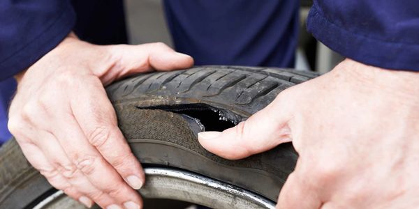 A person holding a tire