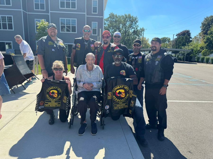 Veterans and supporters outdoors in Combat Veterans Association jackets