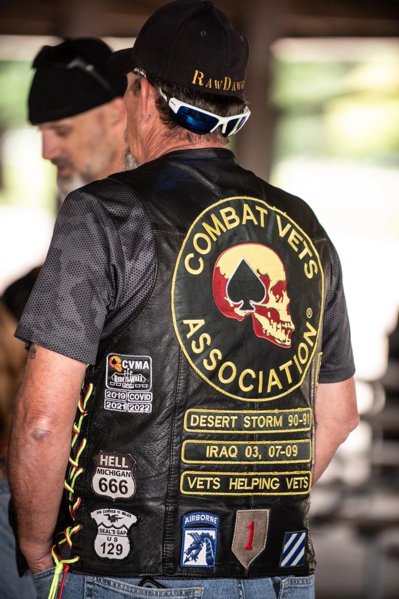 Member wearing a CVMA vest with service patches