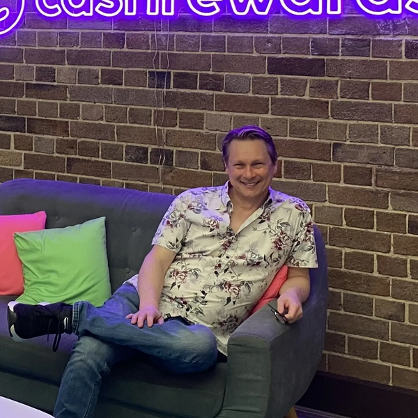 David Martin pictured on a lounge in the Cashrewards.com.au office in Sydney in 2024.