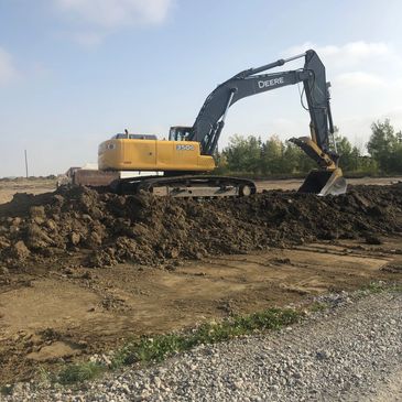 Deere 350 excavator stripping topsoil