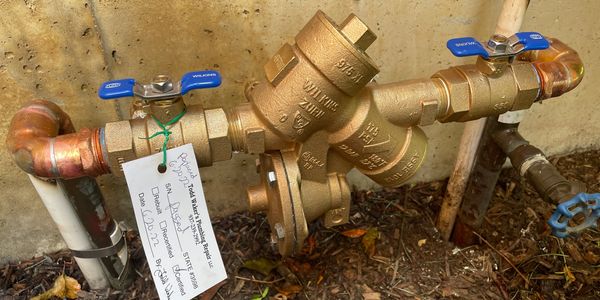 Todd Waker's Plumbing Repair exterior  backflow prevention plumbing system.