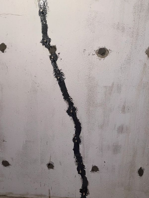 basement crack injection and rod hole repair in Troy Michigan