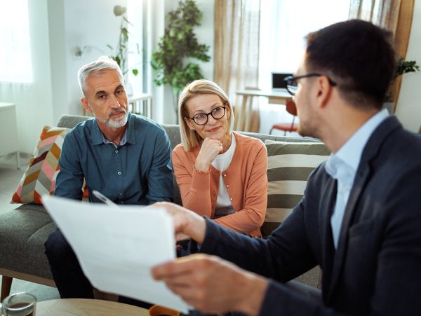 Advisor discussing finances with couple