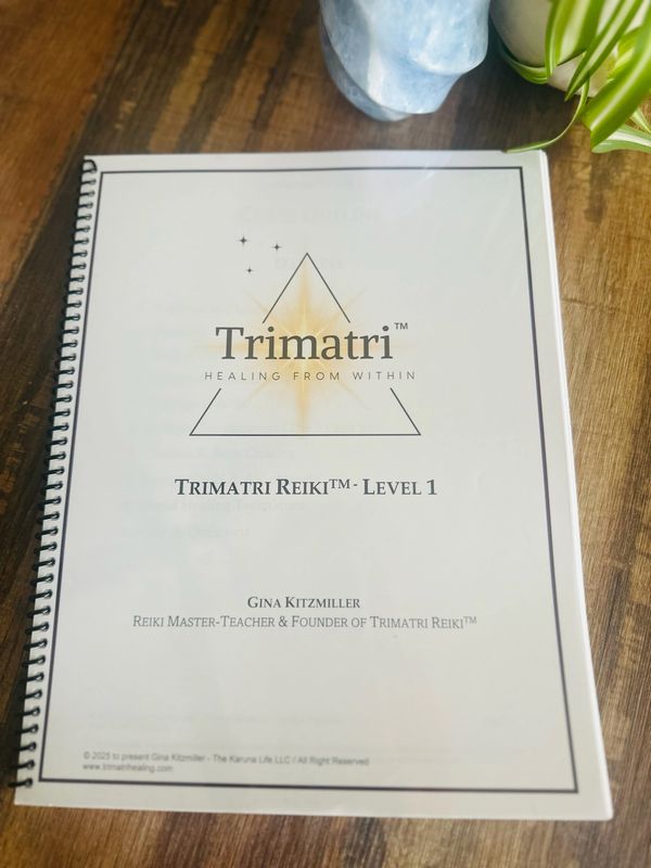 Trimatri Reiki™ Level 1 training manual with energy symbols and attunement guide