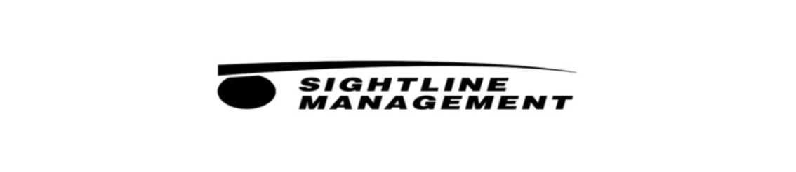 Middle-aged man in white shirt focused on his smartphone.