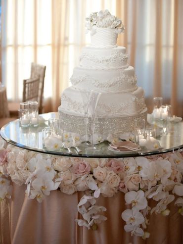 RAISED GLASS CAKE TABLE WITH FLOWERS